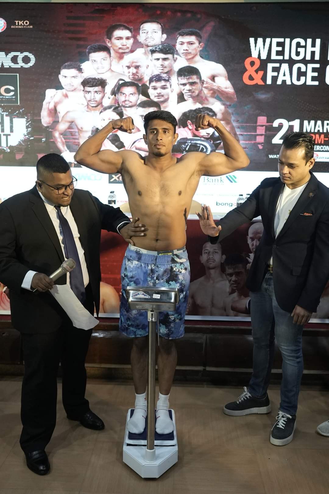 Weighing in on stage before a fight night