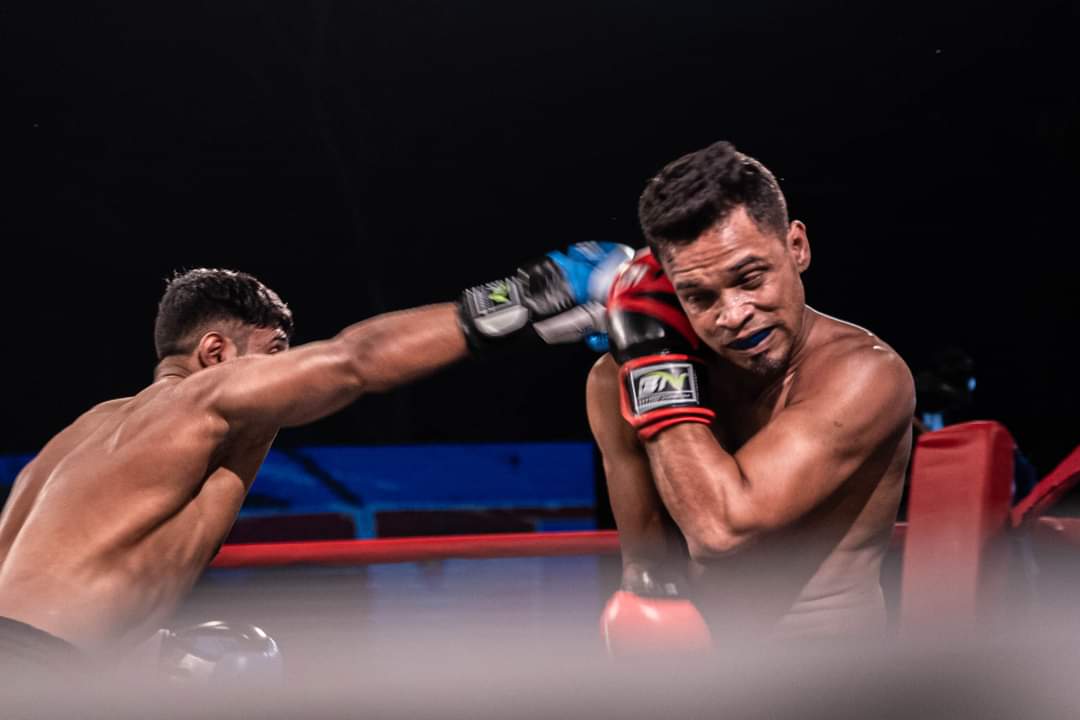 Two boxers trading punches at close range